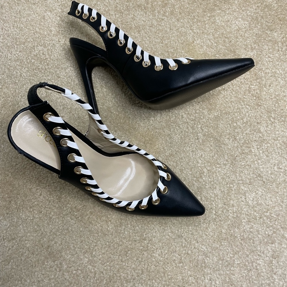 Brand new cute 5 inch black and cream heels.
